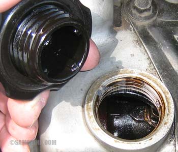 Checking under oil cap